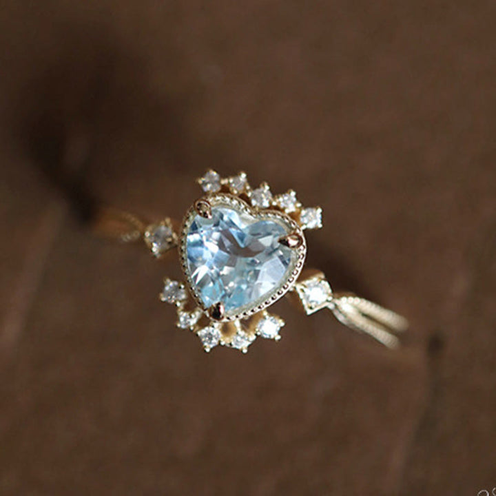 Anillo de topacio azul natural con circonita blanca de Olivenorma