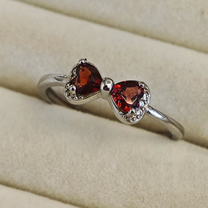 Anillo de plata de ley con lazo de granate natural de Olivenorma