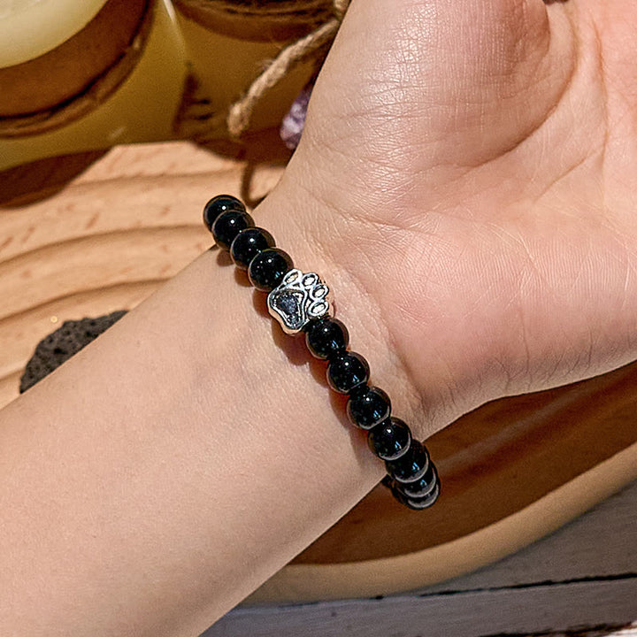 Pulsera con colgante de pata de perro y cuentas de piedra natural de Olivenorma