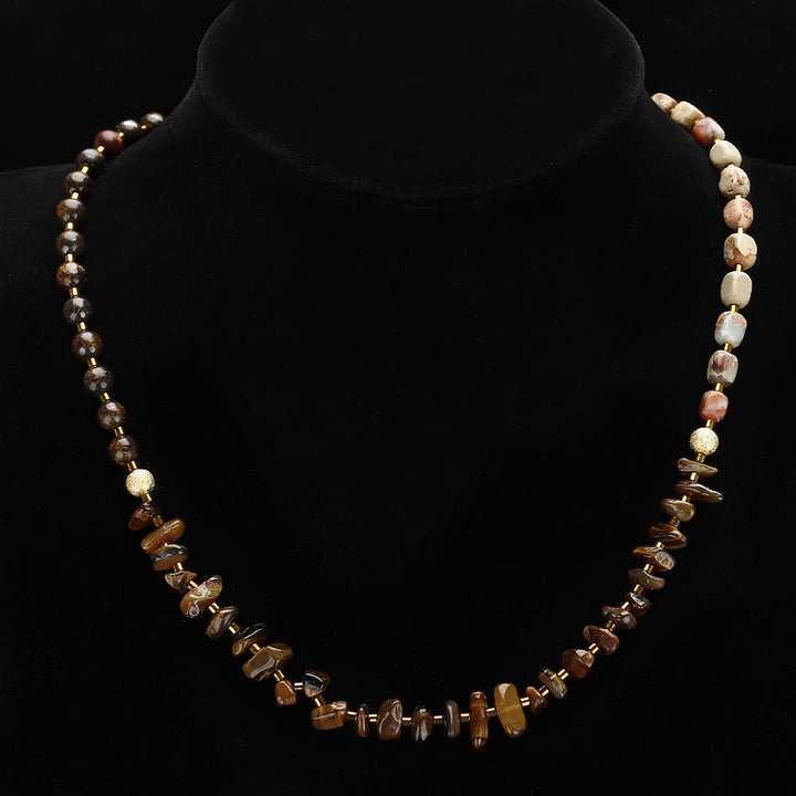 Pulsera de cuentas de ojo de tigre y agalmatolita de Olivenorma