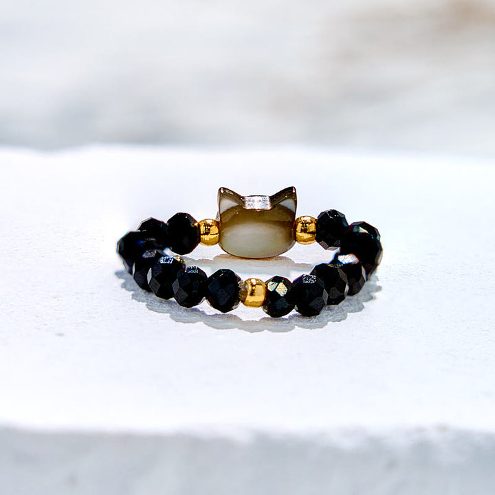 Anillo de cuentas de gatito de cristal transparente de obsidiana natural de Olivenorma