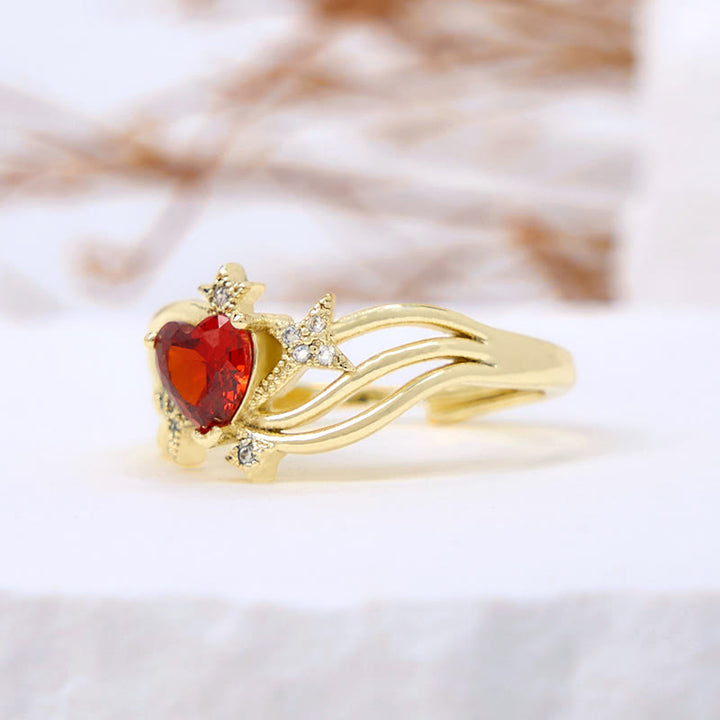 Anillo con forma de corazón y granate y estrella de circonita blanca de Olivenorma