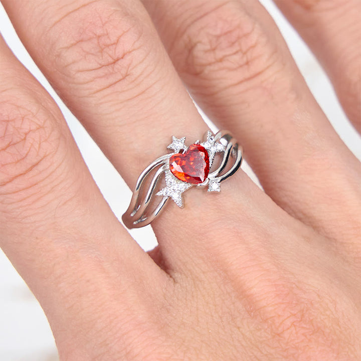 Anillo con forma de corazón y granate y estrella de circonita blanca de Olivenorma