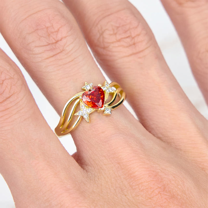 Anillo con forma de corazón y granate y estrella de circonita blanca de Olivenorma