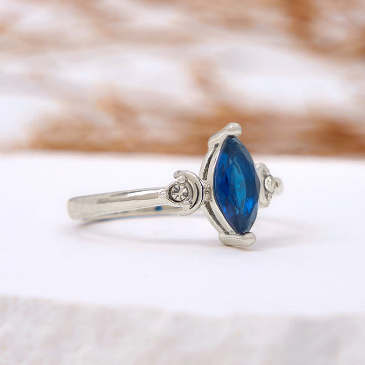 Anillo de topacio azul con circonita blanca y talla marquesa de Olivenorma