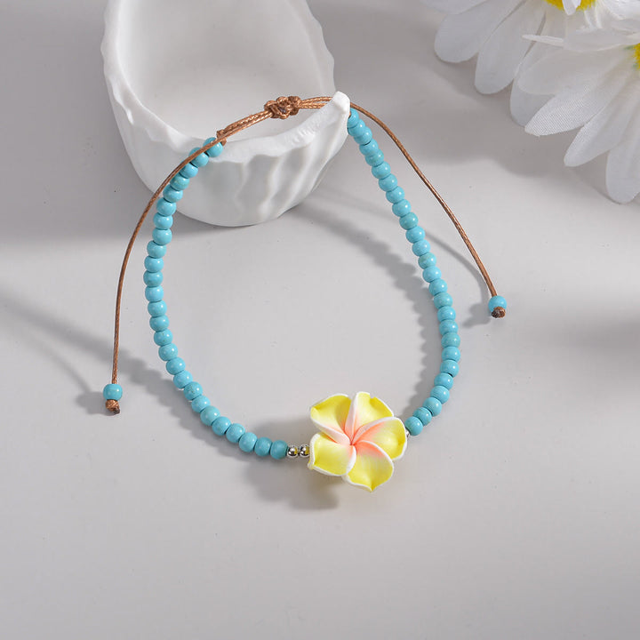 Tobillera con cuentas de plumeria y turquesa de Olivenorma