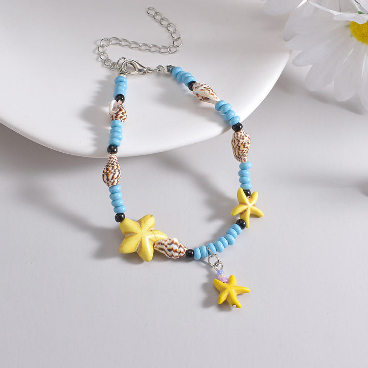 Tobillera con cuentas de estrella de mar en color azul turquesa y amarillo de Olivenorma