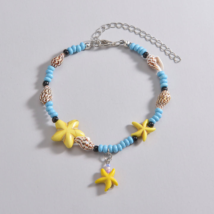 Tobillera con cuentas de estrella de mar en color azul turquesa y amarillo de Olivenorma