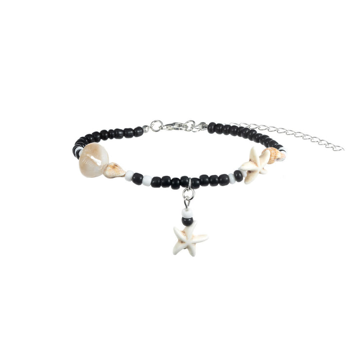 Tobillero con cuentas de caracol y estrella de mar de ónix negro y turquesa de Olivenorma