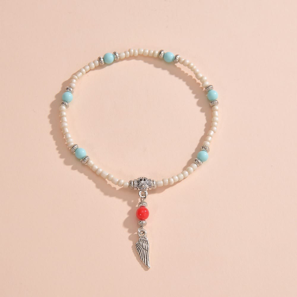 Tobillera con colgante de plumas de metal con cuentas de turquesa blanca de Olivenorma