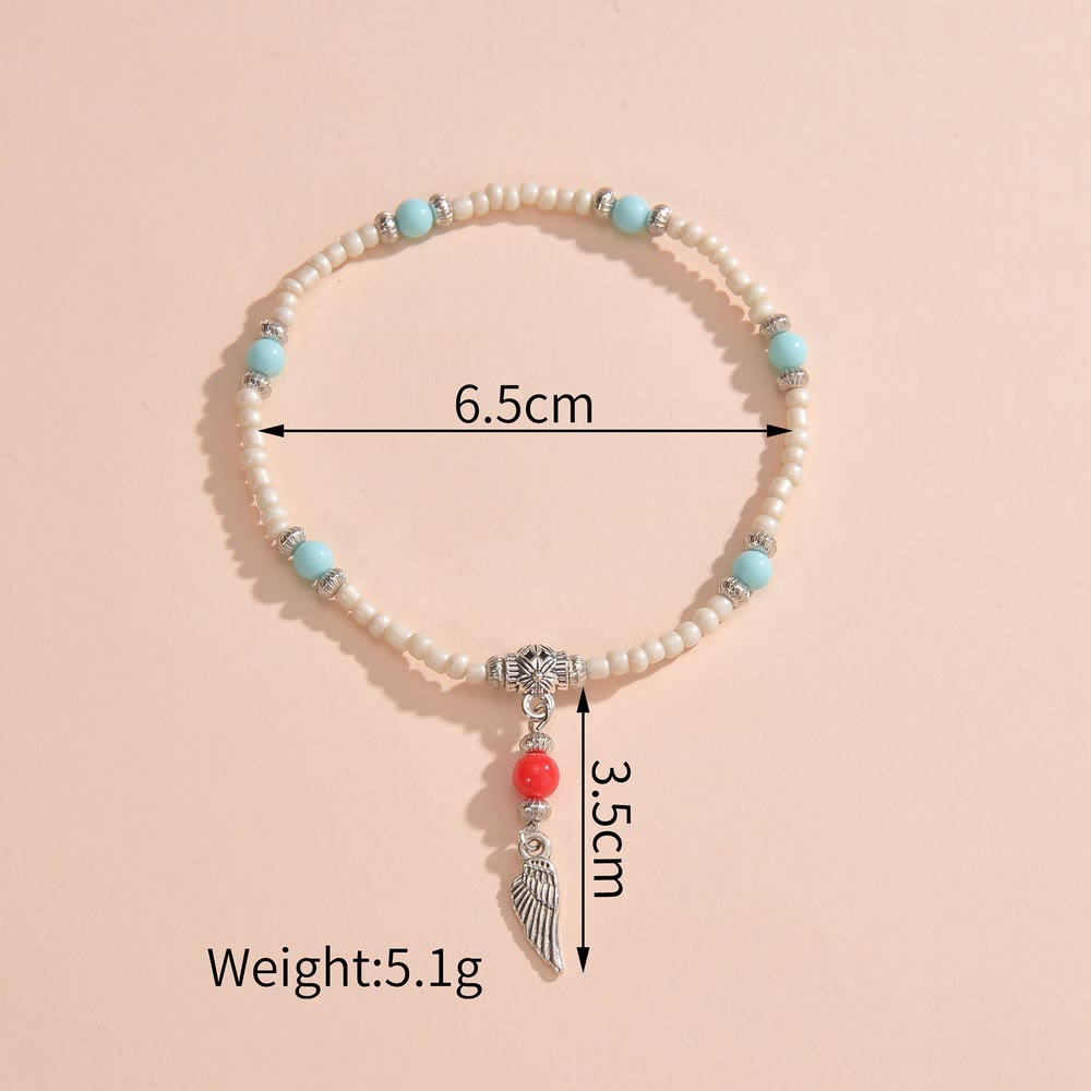 Tobillera con colgante de plumas de metal con cuentas de turquesa blanca de Olivenorma
