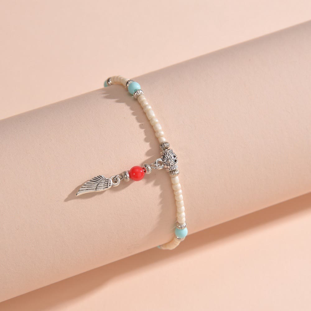 Tobillera con colgante de plumas de metal con cuentas de turquesa blanca de Olivenorma