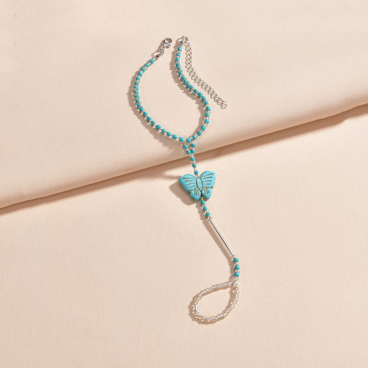Tobillera con piercing de mariposa con cuentas turquesas de Olivenorma