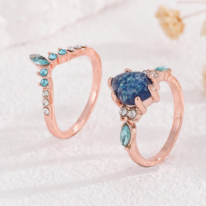 Anillo de corona de topacio azul y ópalo de 2 piezas de Olivenorma