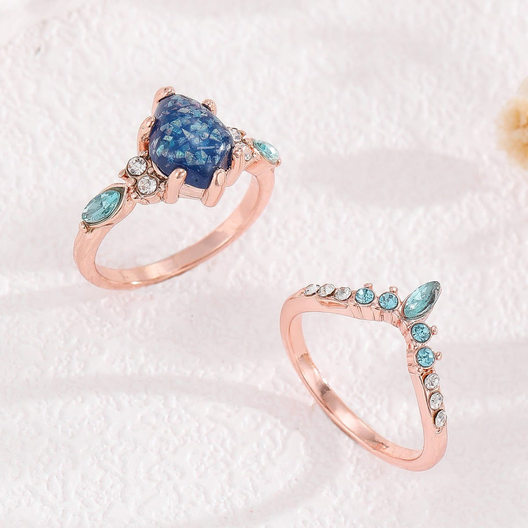Anillo de corona de topacio azul y ópalo de 2 piezas de Olivenorma