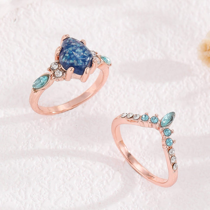 Anillo de corona de topacio azul y ópalo de 2 piezas de Olivenorma