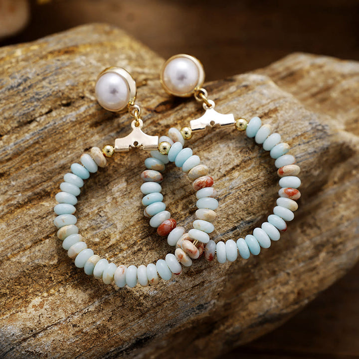 Pendientes con forma de rueda de agalmatolita, amatista, turquesa azul y cuentas en forma de anillo de Olivenorma