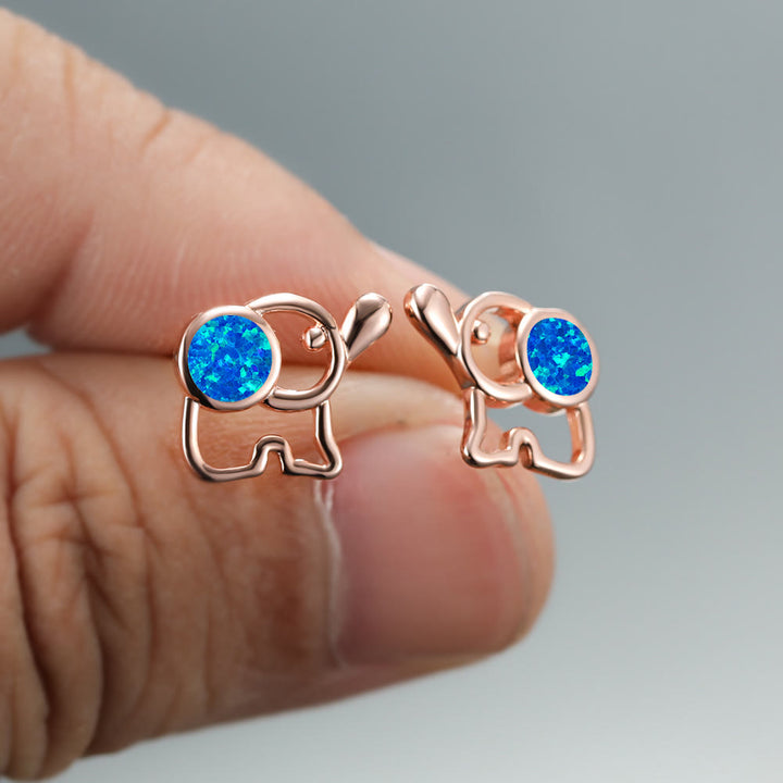 Pendientes con forma de elefante y ópalo azul y blanco de Olivenorma