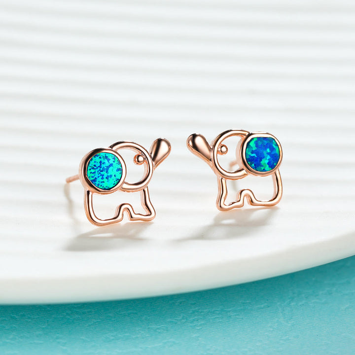 Pendientes con forma de elefante y ópalo azul y blanco de Olivenorma