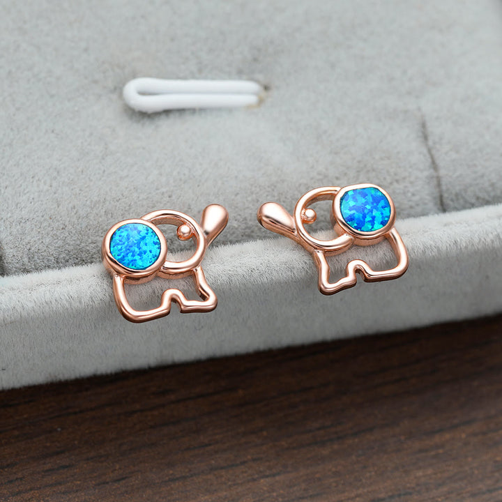 Pendientes con forma de elefante y ópalo azul y blanco de Olivenorma