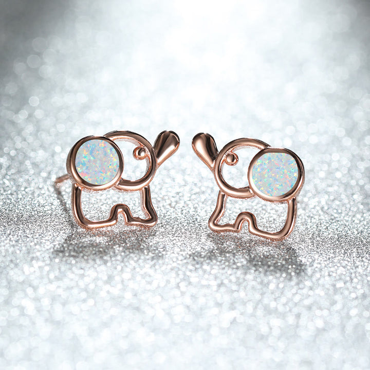 Pendientes con forma de elefante y ópalo azul y blanco de Olivenorma