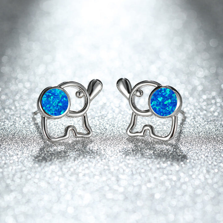 Pendientes con forma de elefante y ópalo azul y blanco de Olivenorma