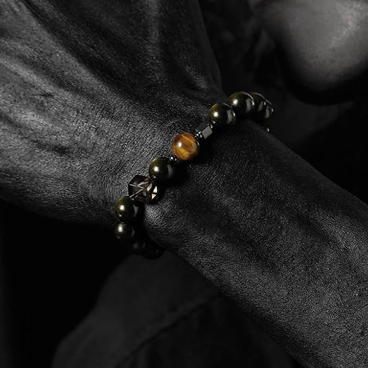 Pulsera de cuentas de obsidiana con sol intenso y luna oscura de Olivenorma