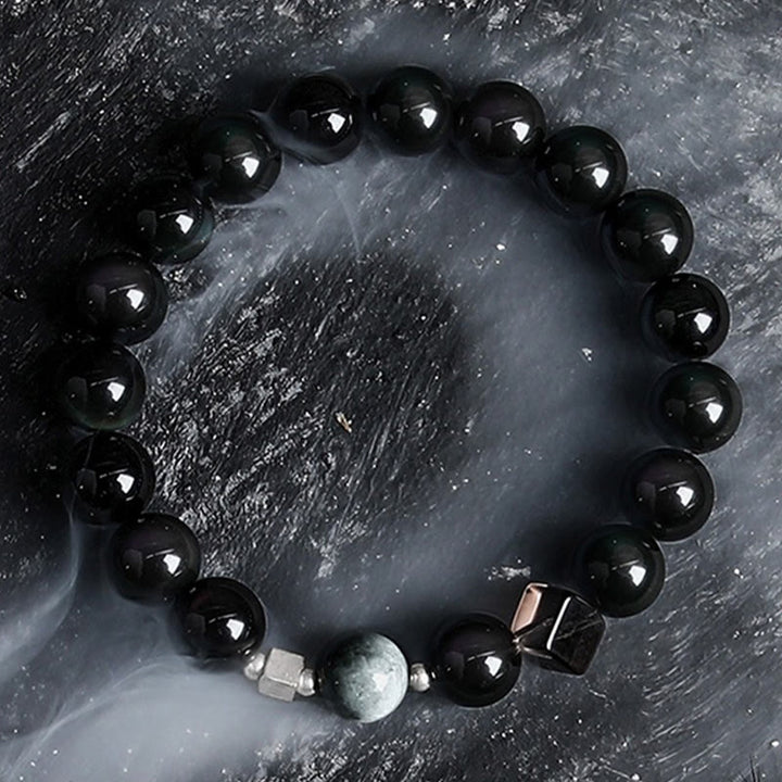 Pulsera de cuentas de obsidiana con sol intenso y luna oscura de Olivenorma