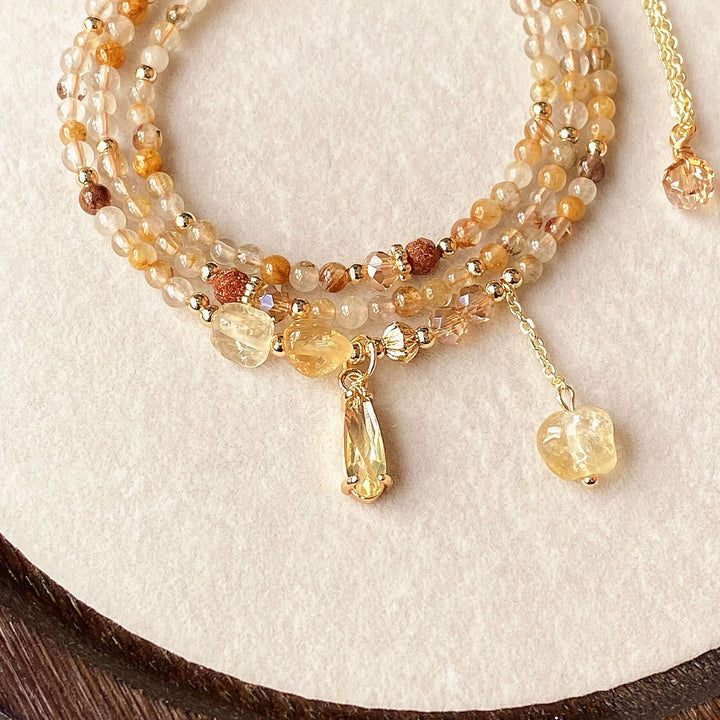 Pulsera y collar de cuentas de cuarzo rutilado en oro y citrino de Olivenorma