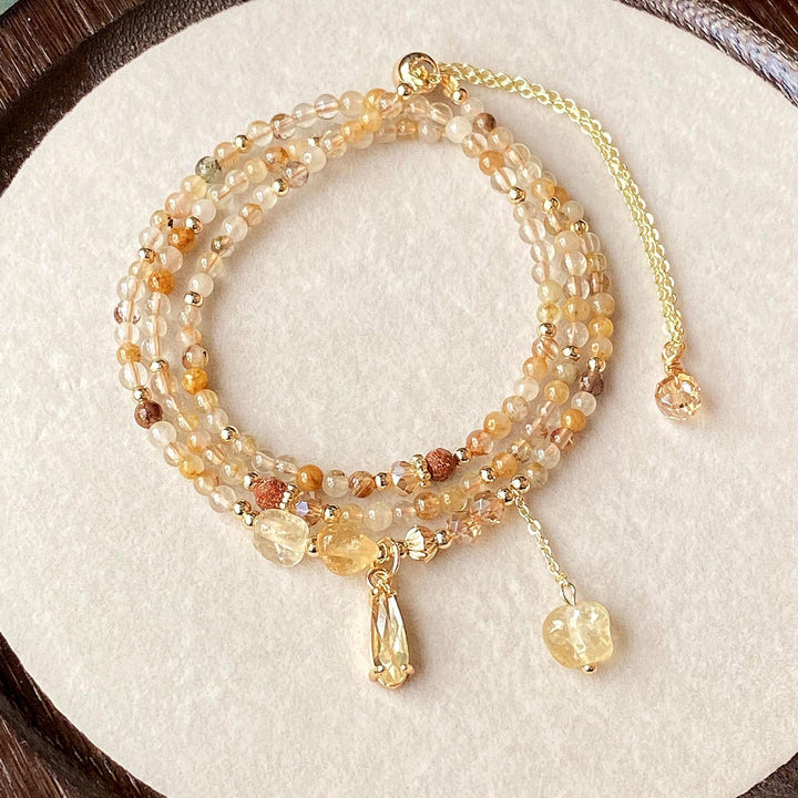 Pulsera y collar de cuentas de cuarzo rutilado en oro y citrino de Olivenorma