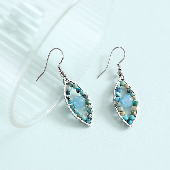 Pendientes colgantes de ojo malvado con turquesa africana y aguamarina de Olivenorma