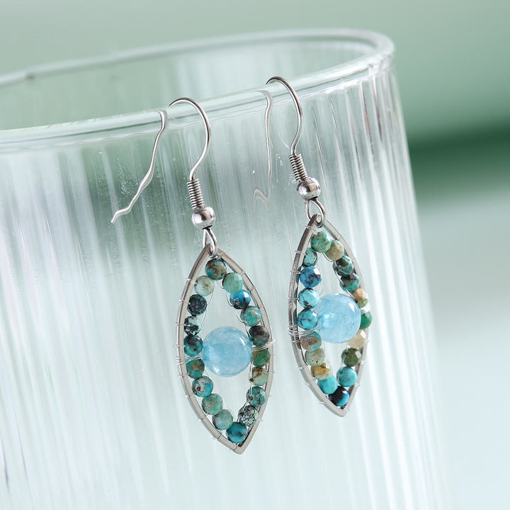 Pendientes colgantes de ojo malvado con turquesa africana y aguamarina de Olivenorma