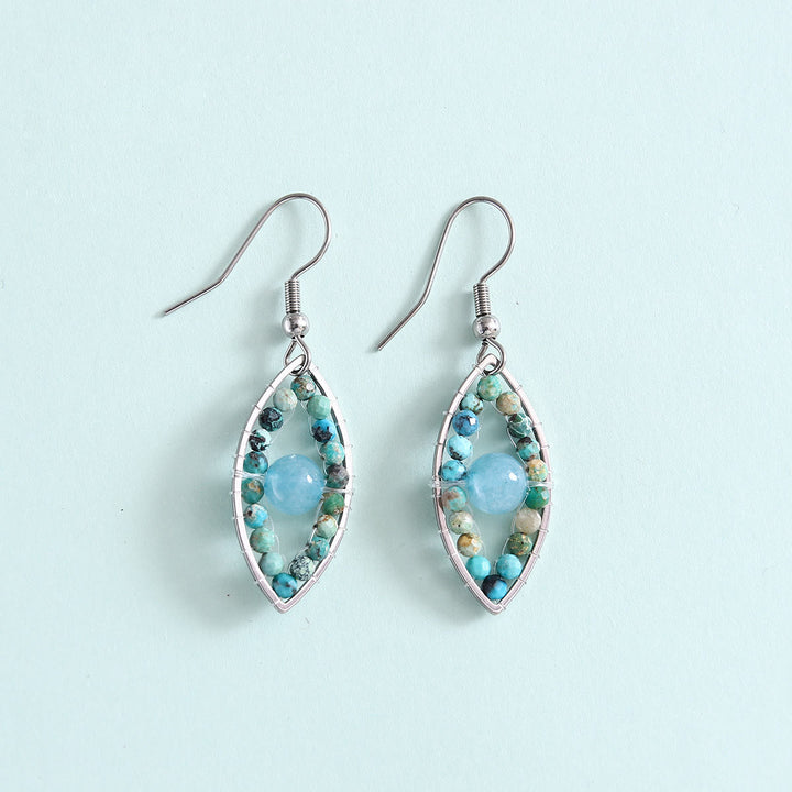 Pendientes colgantes de ojo malvado con turquesa africana y aguamarina de Olivenorma