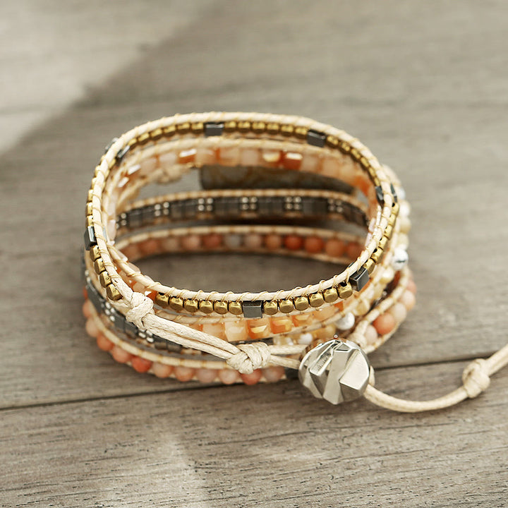 Pulsera trenzada de coral, jade y piedra solar de Olivenorma