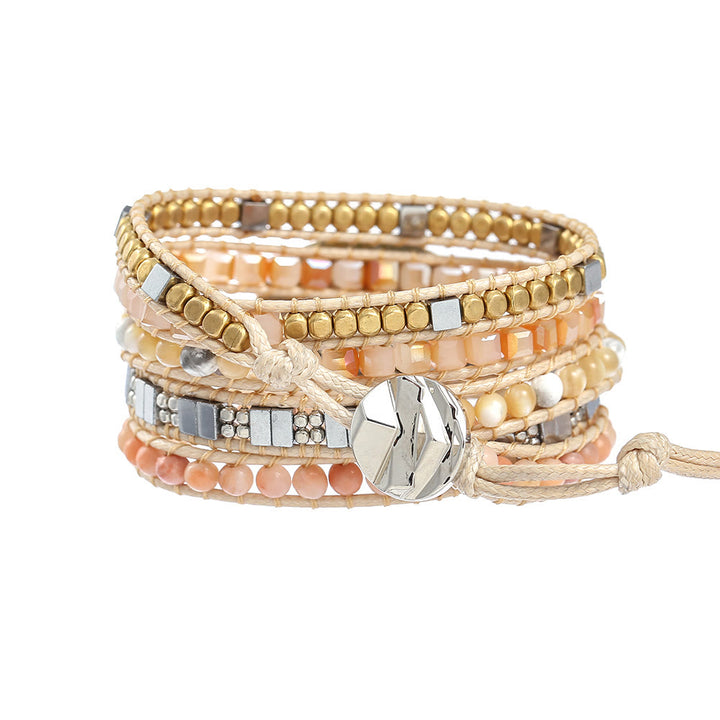 Pulsera trenzada de coral, jade y piedra solar de Olivenorma