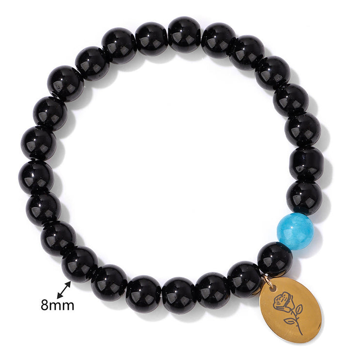 Pulsera Olivenorma de metal con cuentas de obsidiana de 8 mm y flor de nacimiento