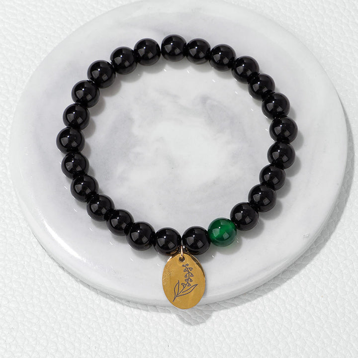 Pulsera Olivenorma de metal con cuentas de obsidiana de 8 mm y flor de nacimiento