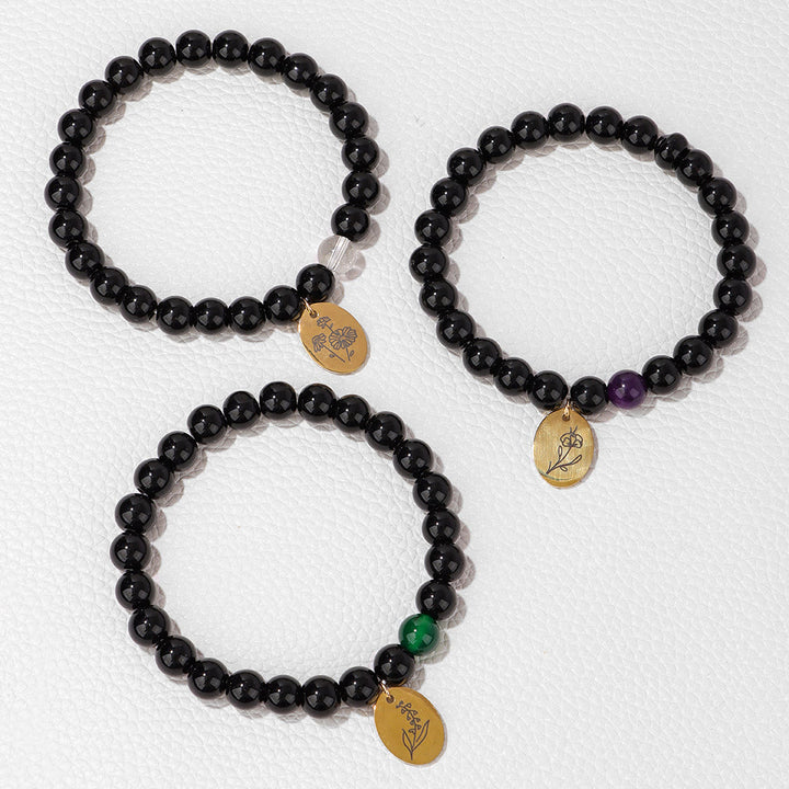Pulsera Olivenorma de metal con cuentas de obsidiana de 8 mm y flor de nacimiento