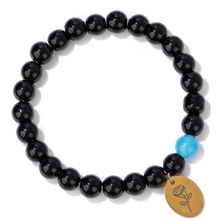 Pulsera Olivenorma de metal con cuentas de obsidiana de 8 mm y flor de nacimiento