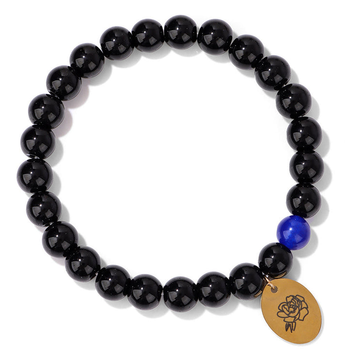 Pulsera Olivenorma de metal con cuentas de obsidiana de 8 mm y flor de nacimiento