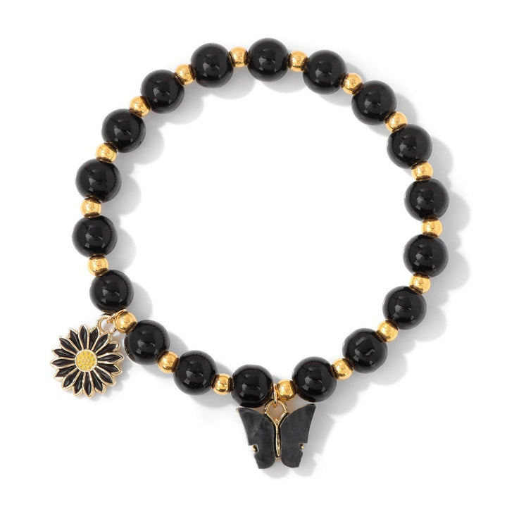 Pulsera con colgante de mariposa y cuentas de cristal natural de Olivenorma