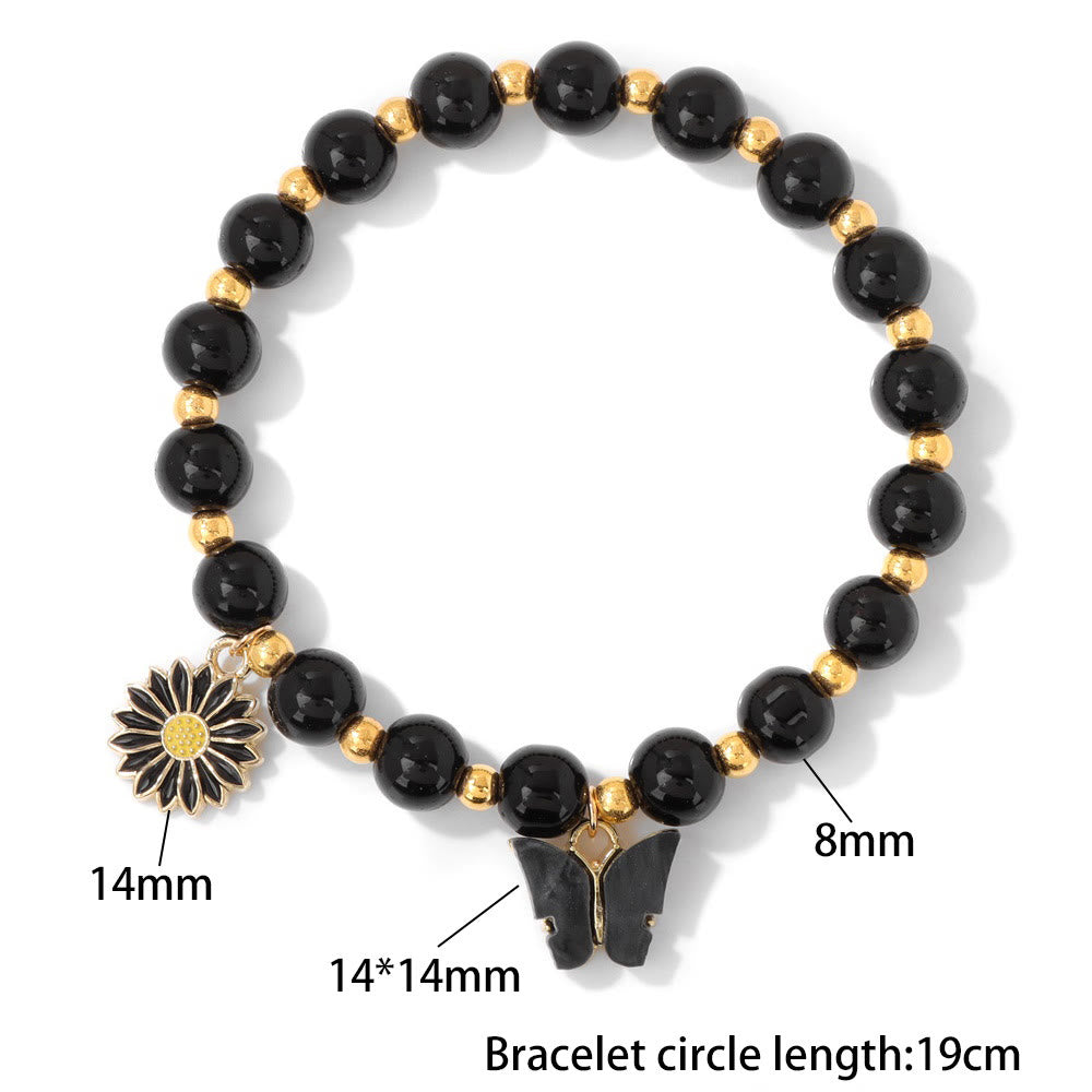 Pulsera con colgante de mariposa y cuentas de cristal natural de Olivenorma