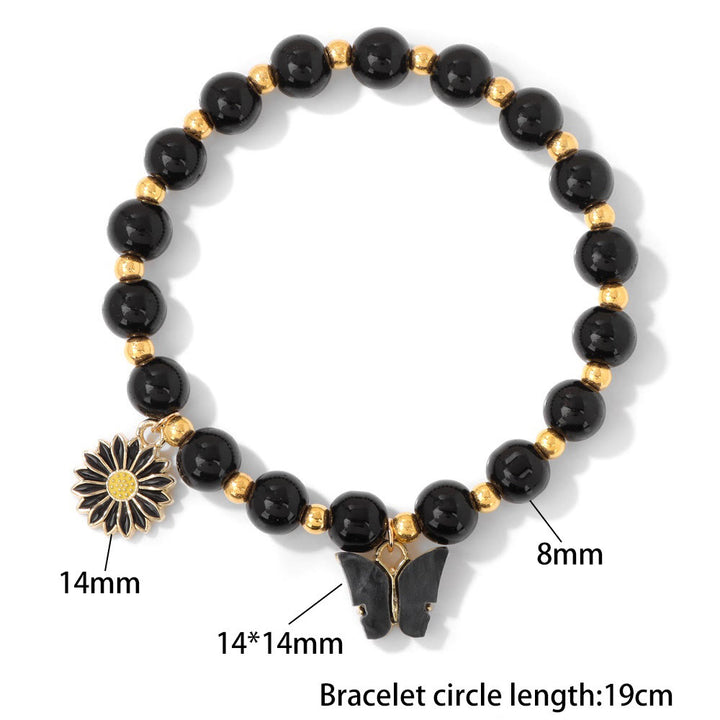 Pulsera con colgante de mariposa y cuentas de cristal natural de Olivenorma