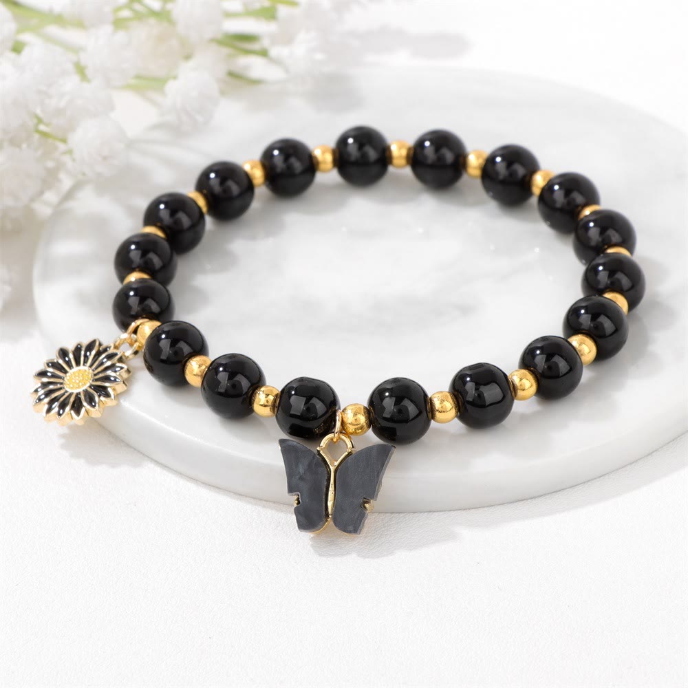 Pulsera con colgante de mariposa y cuentas de cristal natural de Olivenorma