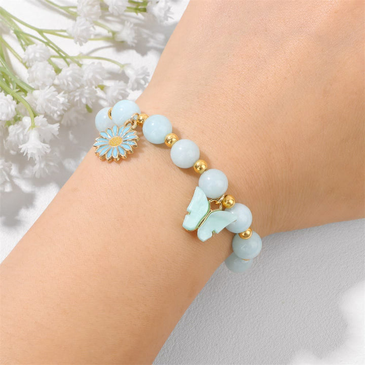 Pulsera con colgante de mariposa y cuentas de cristal natural de Olivenorma