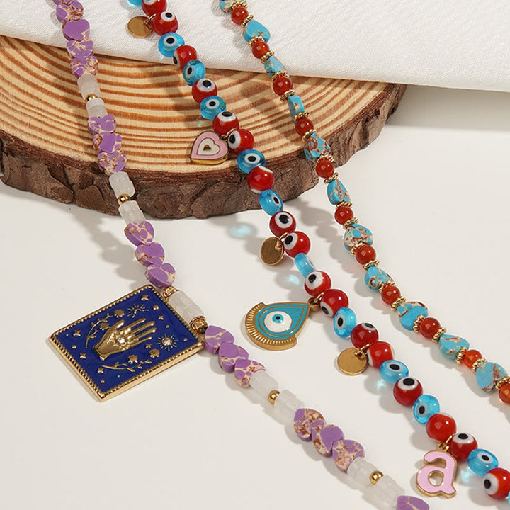 Collar con colgante de ojo malvado y cuentas de piedra del emperador Olivenorma