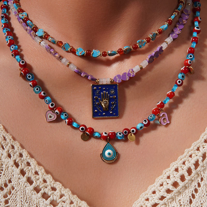 Collar con colgante de ojo malvado y cuentas de piedra del emperador Olivenorma
