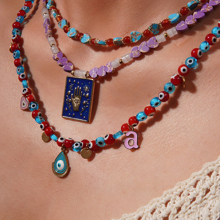Collar con colgante de ojo malvado y cuentas de piedra del emperador Olivenorma