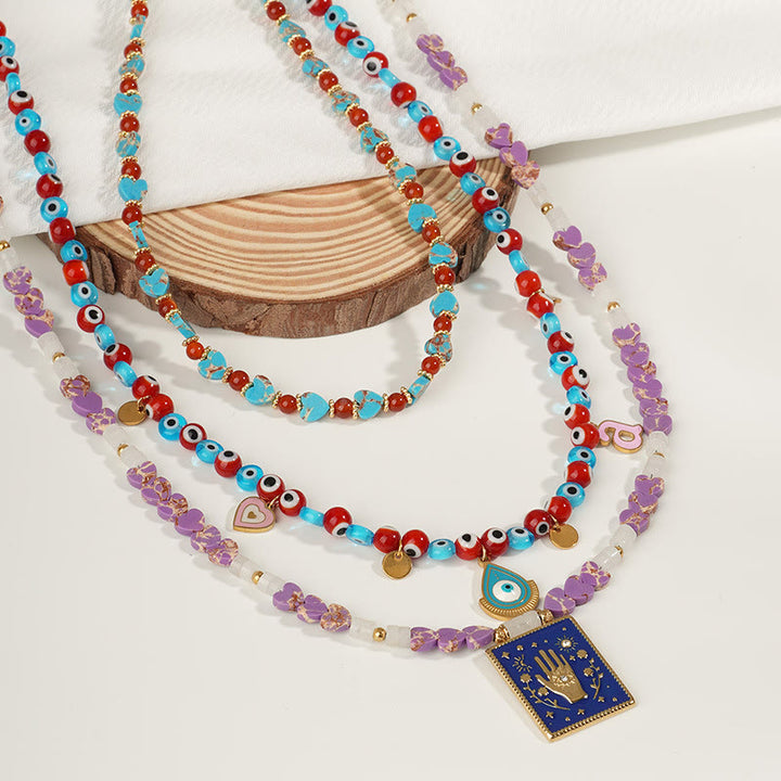Collar con colgante de ojo malvado y cuentas de piedra del emperador Olivenorma