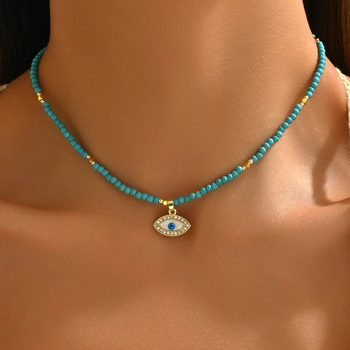 Collar con colgante de ojo malvado con cuentas de cristal natural de Olivenorma